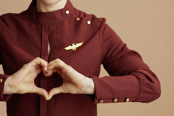 Closeup Stylish Female Stewardess Showing Heart Shaped Hands Isolated Beige — Stock Photo, Image
