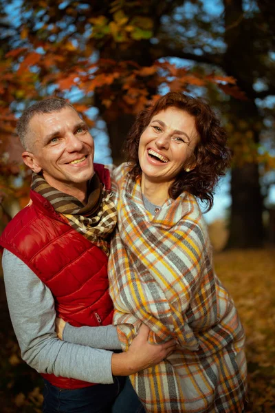 Hello autumn. smiling stylish couple in the park having fun time.