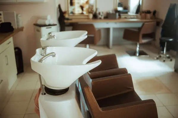 modern beauty salon with chairs and salon backwash unit.