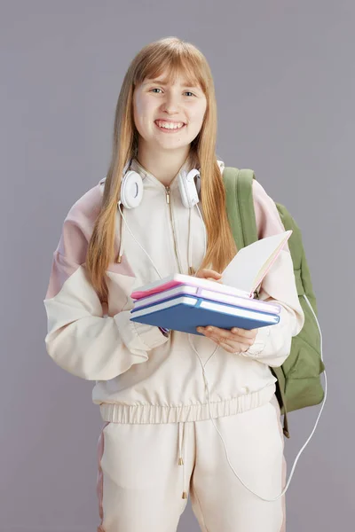 Portrait Smiling Trendy Teenage Girl Beige Tracksuit Backpack Workbooks Headphones — Stock Photo, Image