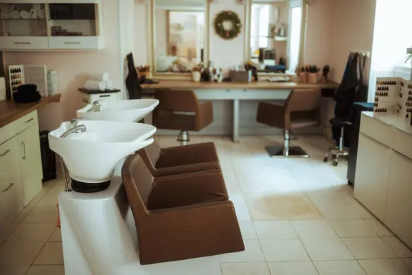 modern beauty salon with chairs, mirror and salon backwash unit.