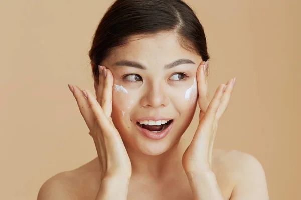 Modern Asian Female Facial Cream Face Beige Background — Stock Photo, Image