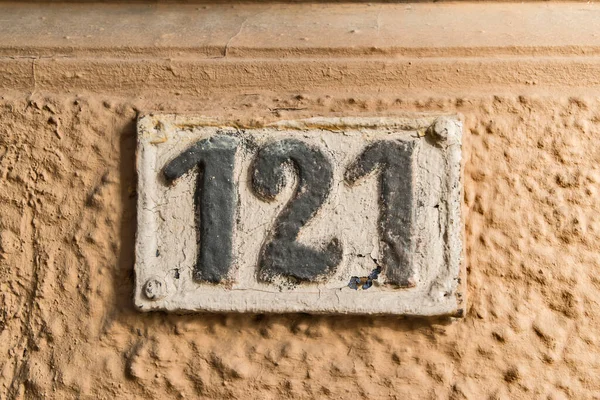 Old Retro Weathered Cast Iron Plate Number 121 Closeup — Stock Photo, Image