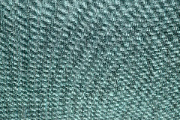 Turquoise green linen fabric texture closeup as textile background