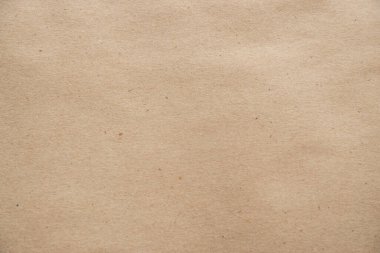 Kahverengi kağıt dokusu arka plan olarak yakın plan. Tasarım ve dekorasyon için eski kağıt sayfası.