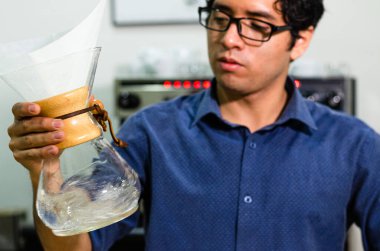 Portrait of professional barista making coffee clipart