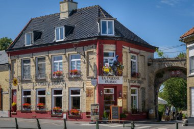 Bergues, France - July 5. 2022: An old traditional house on a clear day in France, blue sky, summer