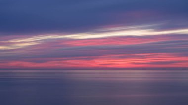 Abstract background of a sunset at the atlantic ocean, long exposure