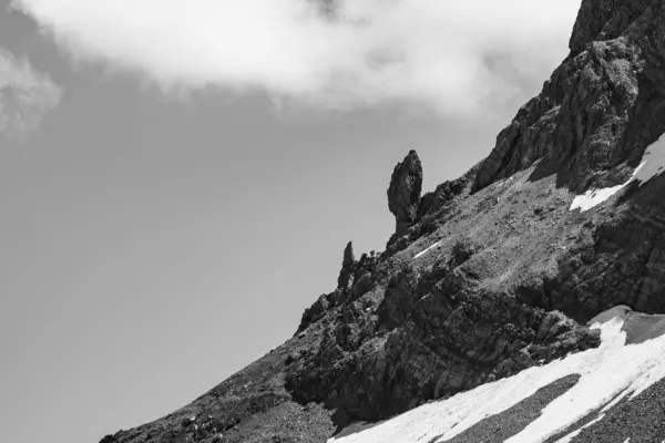 The Ortler Alps near Stelvo Pass on a sunny day in summer, black and white