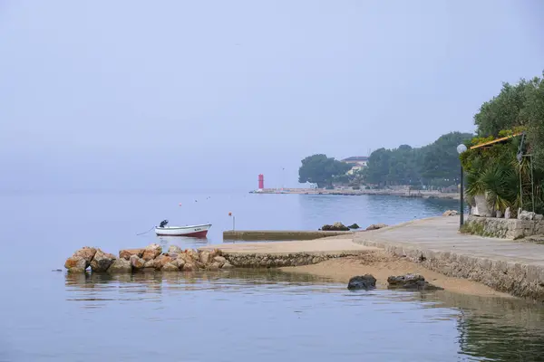 stock image Cres, Croatia - November 11, 2022: An old harbor near the city of cres on a cloudy day