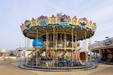 Saintes Maries de la Mer, France - March 9, 2023: Merry go round near the harbor of Saintes Maries de la Mer in winter