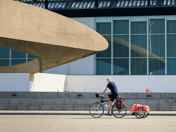 stock image Le Havre, France - July 23, 2022: A man riding a bicycle in Le Havre on a sunny day