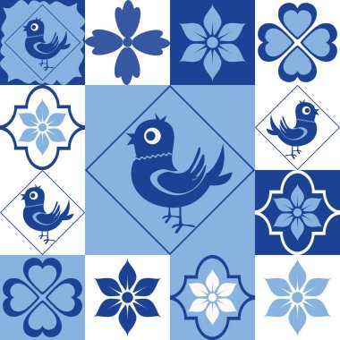 Mavi ve beyaz renkli, çiçekli ve kuşlu fayanslar, arka planda pürüzsüz dekorlar.