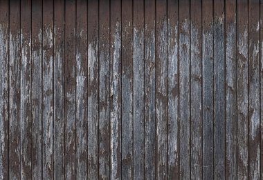 Eski ahşap panoların eski boya kalıntılarıyla fotoğrafı.