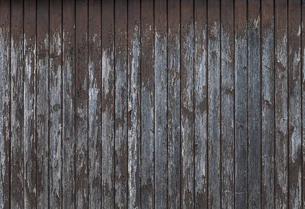 Eski ahşap panoların eski boya kalıntılarıyla fotoğrafı.