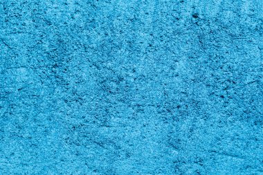 Zengin desenli, mavi renkli eski beton duvar.