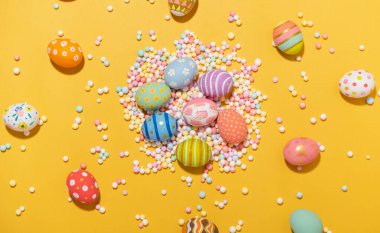 Happy easter Colourful of Easter eggs on yellow background. Greetings and presents for Easter Day celebrate time. Flat lay ,top view.