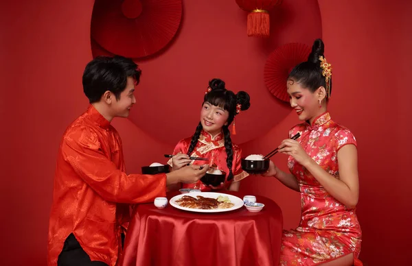 Happy Chinese new year. Asian family dinner food for prosperity celebration festival isolated on red decoration traditional festival background.
