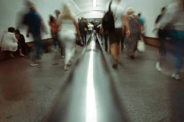 Abstract background of blurred movement of people in the underpass. Abstraction, motion blur