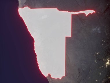 Namibya, şehir ışıklarıyla dolu bir gece haritasında kırmızı ve parlak sınırlarla işaretlenmiş. Bu görüntünün öğeleri ESA tarafından desteklenmektedir.