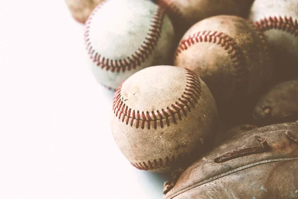Baseball sports banner with old used game balls and glove, closeup view
