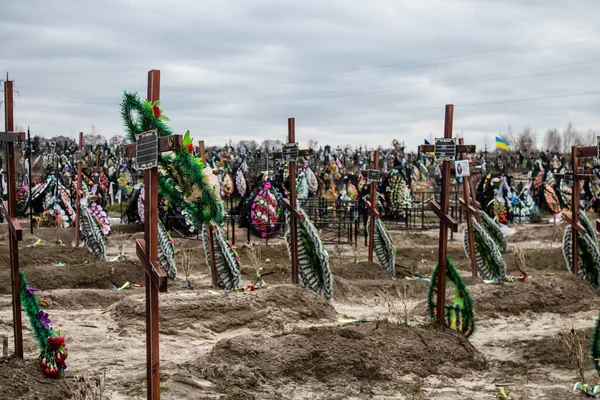 stock image A lot of new graves are pictured at the central cemetery of Irpin, a city liberated from Russian invaders. Many of his graves are unmarked because it has been impossible to identify his victims of war crimes