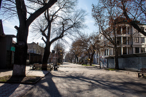 Cityscape and facade of building in Kherson city. The city of Kherson is constantly under Russian bombardment, there are very few civilians left and all the businesses are closed. Buildings are civilian targets