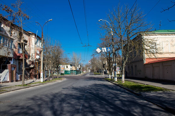 Cityscape and facade of building in Kherson city. The city of Kherson is constantly under Russian bombardment, there are very few civilians left and all the businesses are closed. Buildings are civilian targets