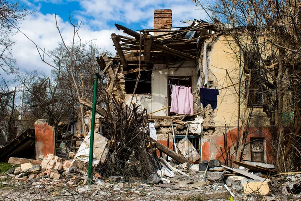 stock image Building damage by artillery in Kherson city. The city of Kherson is constantly under Russian bombardment, there are very few civilians left and all the businesses are closed. Buildings are civilian targets