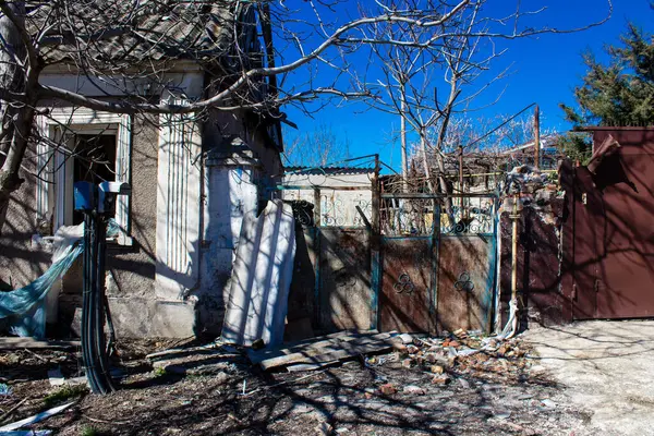 stock image Building damage by artillery in Kherson city. The city of Kherson is constantly under Russian shelling, there are very few civilians left and all the businesses are closed. Buildings are civilian targets