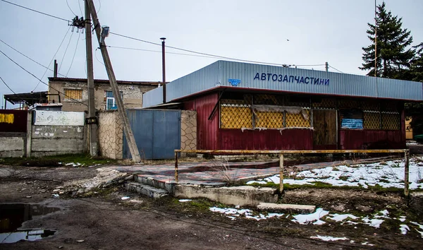 stock image The buildings as well as the businesses were badly damaged by the bombardments during the battle of Lyman which followed the Russian invasion. Civilians are targets, these are war crimes.