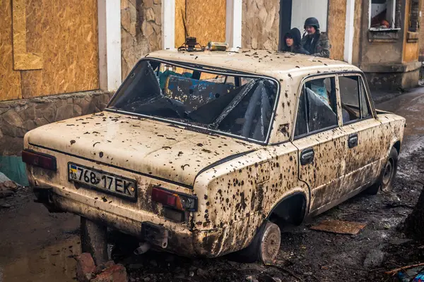 Stock image Destroyed Lada automobile on the streets of the city of Chasiv Yar. This small town is very close to the combat zones. civilians are targets for the russian army and they regularly shoot cars