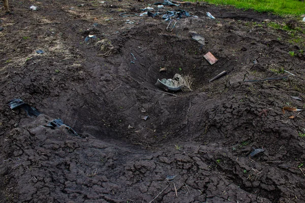 stock image Aftermath of a mine explosion. The car is totally destroyed and debris is strewn all around. A large number of defensive and attack explosives are used by the Russian army. Its explosives are a danger for the population because they are placed everyw