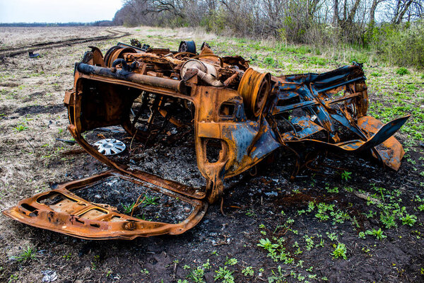 Aftermath of a mine explosion. The car is totally destroyed and debris is strewn all around. A large number of defensive and attack explosives are used by the Russian army. Its explosives are a danger for the population because they are placed everyw
