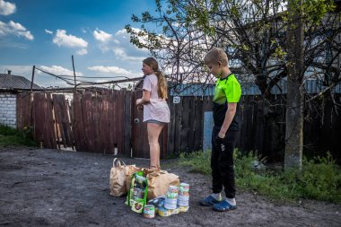 Teenagers from the village of Yampil, Donetsk oblast in Ukraine. Children can no longer go to school, which no longer exists. Children are forced to live without basic necessities, including heating, running water and electricity. The front line is c clipart