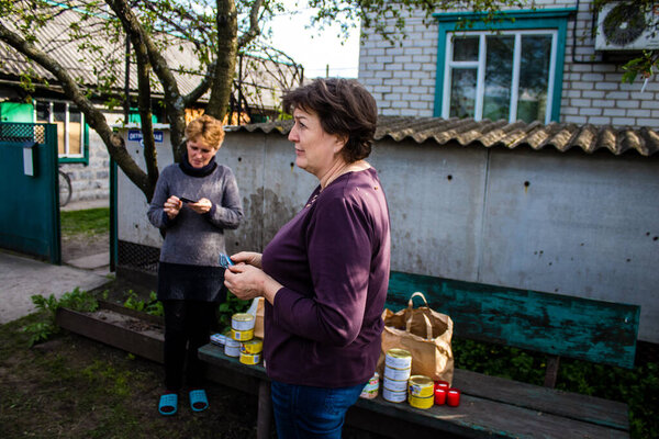 Residents of the village of Yampil, Donetsk Oblast in Ukraine. People survive thanks to the humanitarian aid brought in by volunteers. Houses are in ruins and civilians are forced to live without basic necessities, including heat, running water and e