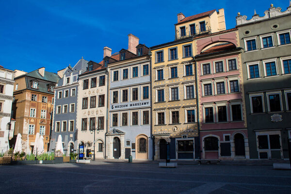Warsaw, Poland - May 28, 2023 Facade of restored medieval building around Stary Rynek, Old Town Market Place. The urban complex is almost entirely reconstructed after the WWII total destruction.