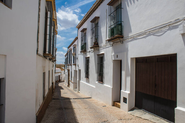 Carmona, Spain - June 10, 2023 Architecture and cityscape of Carmona's town. View of the narrow white streets of one of the oldest cities in Europe and an emblematic place in Andalusia, southern Spain