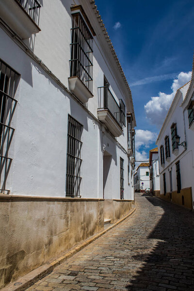 Carmona, Spain - June 10, 2023 Architecture and cityscape of Carmona's town. View of the narrow white streets of one of the oldest cities in Europe and an emblematic place in Andalusia, southern Spain