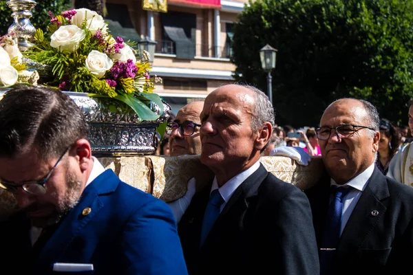 stock image Carmona, Spain - June 11, 2023 Honorary citizen participating in the feast of Corpus Christi. Their mission is to carry the religious statues. The procession takes place in the old town of Carmona which is reputed to be one of the most religious town