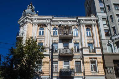 Kyiv , Ukraine - July 19, 2023 Facade of a building and architecture of the city of Kyiv, the capital of Ukraine during the war with Russia, the historical and modern buildings of Kyiv are the target of Russian missiles or drones. 