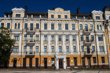 Kyiv , Ukraine - July 19, 2023 Facade of a building and architecture of the city of Kyiv, the capital of Ukraine during the war with Russia, the historical and modern buildings of Kyiv are the target of Russian missiles or drones. 