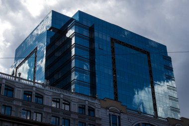 Kyiv , Ukraine - July 19, 2023 Facade of a building and architecture of the city of Kyiv, the capital of Ukraine during the war with Russia, the historical and modern buildings of Kyiv are the target of Russian missiles or drones. 