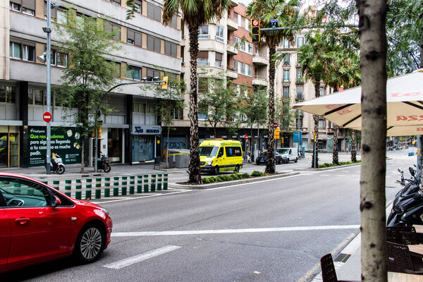 Barcelona, Spain - August 28, 2023 Ambulance driving in the city center of Barcelona, an emblematic city and the capital of Catalogne in Spain.