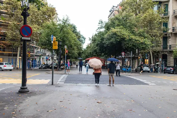 stock image Barcelona, Spain - August 28, 2023 Tourists walking near the Gaudi house in the streets of Barcelona, an emblematic city and the capital of Catalonia in Spain.