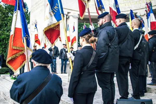 stock image Reims, France - November 11, 2023 Veterans carry flags in the commemoration ceremony of the Armistice marking the end of the First World War