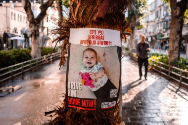 Tel Aviv, Israel - December 6, 2023 Posters of the face of the hostages kidnapped by Hamas during the terrorist attack of October 7, 2023 are displayed in the streets of Tel Aviv. clipart