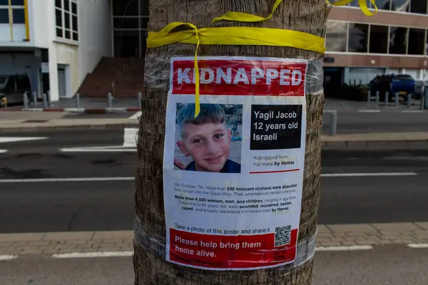 stock image Tel Aviv, Israel - December 13, 2023 Posters of the face of the hostages kidnapped by Hamas during the terrorist attack of October 7, 2023 are displayed in the streets of Tel Aviv.