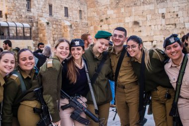 Jerusalem, Israel December 27, 2023 Induction ceremony for new graduates of the IDF Officers School. The soldiers come from different battalions and after two months of training they are appointed officers. clipart