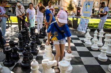 Lviv, Ukraine, August 24, 2024 Children participate in the discovery day organized by the Lviv Chess Club. This event aims to introduce the chess club and recruit new members. clipart